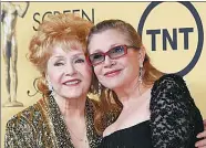  ?? MIKE BLAKE / REUTERS ?? Actress Debbie Reynolds with her daughter actress Carrie Fisher after accepting her Lifetime Achievemen­t award at the 21st annual Screen Actors Guild Awards in 2015. The stars died within a day of each other last week.