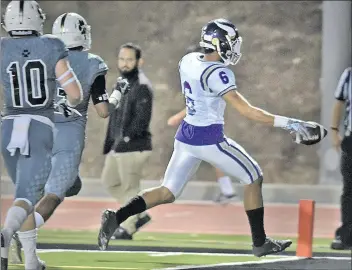  ?? Dan Watson
/For The Signal ?? (Left) Valencia's Jayvaun Wilson goes in untouched for a touchdown in the first quarter at Calabasas High School on Thursday. Valencia lost the game, 65-63, in Calabasas.