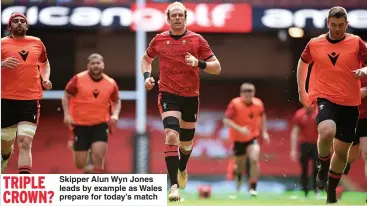  ??  ?? TRIPLE
Skipper Alun Wyn Jones leads by example as Wales CROWN?
prepare for today’s match