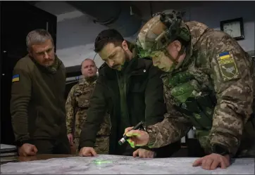  ?? EFREM LUKATSKY — THE ASSOCIATED PRESS FILE ?? Ukrainian President Volodymyr Zelenskyy, Commander of Ukraine’s Ground Forces Col.-gen. Oleksandr Syrsky, right, look at a map during their visit to the front line city of Kupiansk, Kharkiv region, Ukraine, on Nov. 30, 2023. Oleksandr Syrsky was appointed as new Commander-in-chief of Ukraine’s Armed Forces.