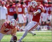  ?? NATI HARNIK — THE ASSOCIATED PRESS FILE ?? In this file photo, Nebraska kicker Drew Brown (34) kicks a field goal with Sam Foltz, left, holding during the first half of an NCAA college football game against Southern Miss in Lincoln, Neb. Foltz and former Michigan State punter Mike Sadler died...