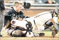  ?? MARCIO JOSE SANCHEZ/AP FILE, 2011 ?? The Florida Marlins’ Scott Cousins, top, collides with San Francisco Giants catcher Buster Posey on a fly ball hit by Marlins’ Emilio Bonifacio in San Francisco.