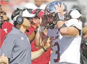  ?? NATI HARNIK/ASSOCIATED PRESS FILE PHOTO ?? Troy head coach Neal Brown would be a coach New Mexico would like to have, but might be a long shot to acquire.