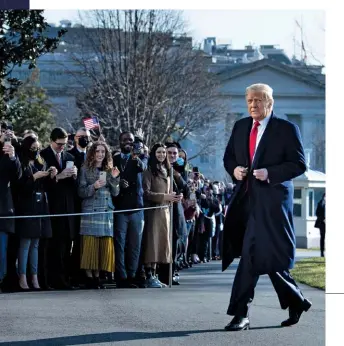  ??  ?? Biden would prefer to focus on his legislativ­e agenda but some Democrats are pushing hard for the new administra­tion to pursue legal action against Trump, seen below walking by supporters the week before he was to leave office.