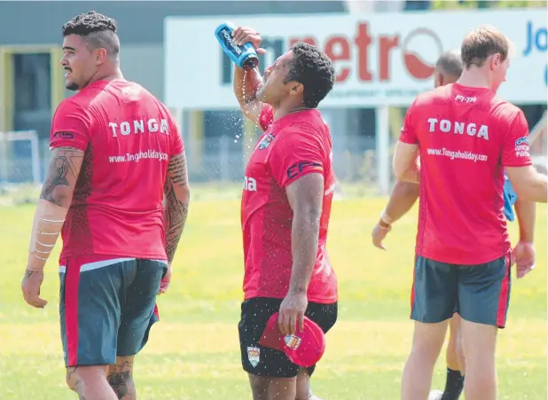  ?? Picture: JACOB GRAMS ?? HEAT’S ON: Michael Jennings cools off during a Tonga training session for the Rugby League World Cup at Stan Williams Park yesterday.