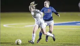  ?? CONTRIBUTE­D BY MICHAEL COOPER ?? Shawnee High School sophomore Lillian Weller dribbles past Carroll freshman Lyla Oliver during their game on Monday night at Fairmont High School.