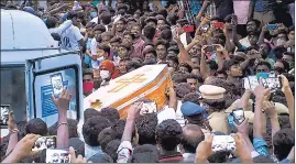  ?? AFP ?? Residents carry the coffin of Jayaraj for burial in Thoothukud­i on June 26.