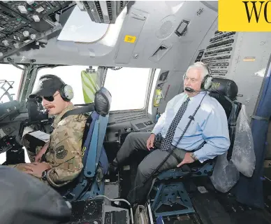  ?? ALEX BRANDON / THE ASSOCIATED PRESS ?? U.S. Secretary of State Rex Tillerson talks with the pilots in the cockpit of a C-17 aircraft Monday on the way to Bagram Air Base in Afghanista­n. Tillerson met with Afghan President Ashraf Ghani and other Afghan leaders.