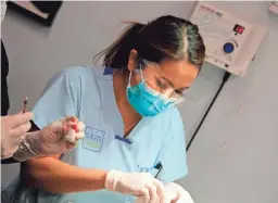  ??  ?? Dr. Sandra Lee stars in TLC’s “Dr. Pimple Popper.” On the show, Lee sees patients with real medical issues like giant, painful cysts that affect their daily lives and self-esteem.