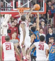  ?? Alan Jamison/Special to the News-Times ?? Rejected: Arkansas forward Moses Kingsley (33) blocks a shot by Florida guard KeVaughn Allen (5) during their game in Fayettevil­le earlier this season. Today, Arkansas hosts Georgia in their final home game of the season.