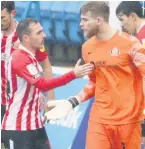  ??  ?? LEE WAY Lee Burge is congratula­ted after he saved a penalty for Sunderland