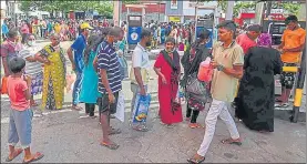  ?? AFP ?? People queue up to buy kerosene for domestic use at a supply station in Colombo