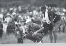  ?? THE ASSOCIATED PRESS ?? Jordan Spieth and his caddie Michael Greiler line up a putt on the ninth green during the final round of the British Open Golf Championsh­ip on Sunday at Royal Birkdale, Southport, England.