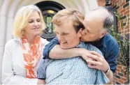  ?? LM OTERO/ASSOCIATED PRESS ?? Clay Heighten, right, and Debra Caudy embrace their autistic 19-year-old son Jon Heighten as they pose for a photo at their home in University Park, Texas.