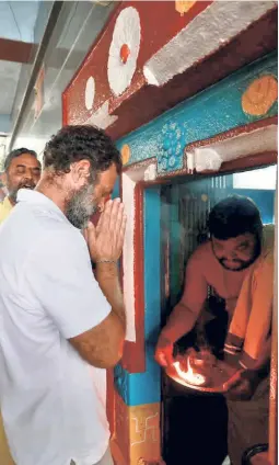  ?? ?? RAHUL GANDHI at the Gangabhava­ni Temple in Adoni, Telangana, during the yatra. He has raised important questions on democracy, pluralism, and so on, but has failed to cut ice with the Hindu vote bank.