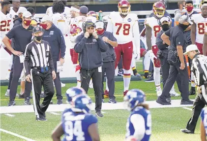  ?? JOHN MINCHILLO/AP ?? Washington coach Ron Rivera watches his team play during the second half of a 20-19 loss to the Giants on Sunday.