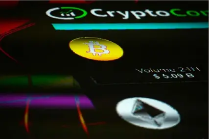  ?? Mary Turner/Bloomberg ?? The symbols for Bitcoin and Ethereum cryptocurr­ency are displayed during the 2018 Crypto Investor Show in London. The spectacula­r plunge and trading halts of the algorithmi­c stablecoin TerraUSD are touching off a debate among lawmakers over whether, and how much, the government should get involved. Many officials in Washington are calling for quick action, though that may end up being the only thing they agree upon easily.