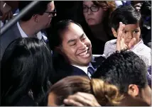  ?? ERIC GAY — THE ASSOCIATED PRESS ?? Former San Antonio Mayor and Housing and Urban Developmen­t Secretary Julián Castro, center, greets supporters Saturday.