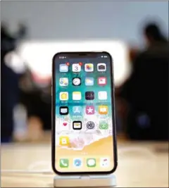  ?? JUSTIN SULLIVAN/AFP ?? The new iPhone X displayed at an Apple Store last week in California.