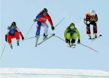  ?? AP ?? Russia’s Egor Korotkov ( from left), Jean Frederic Chapuis of France, Germany’s Paul Eckert and Dave Duncan of Canada in action in the men’s ski cross eliminatio­n round at the Winter Olympics on Wednesday. —