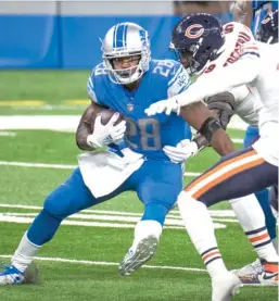  ?? NIC ANTAYA/GETTY IMAGES ?? On several plays Sunday, Lions running back Adrian Peterson racked up significan­t yardage before the Bears could touch him.