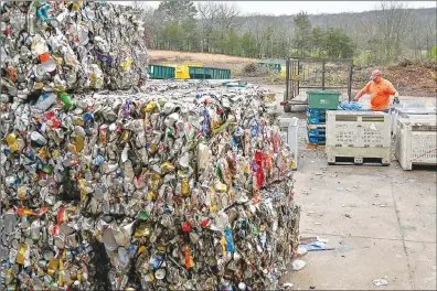  ?? Caleb Grieger/NWA Democrat Gazette ?? Matt Partain sorts through bags of recycling Friday at Boston Mountain Solid Waste District in Prairie Grove.