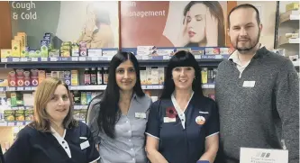  ??  ?? Going the extra mile: Staff at Day Lewis Denne Pharmacy in North Heath Lane, Horsham