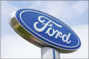  ?? ASSOCIATED PRESS FILE PHOTO ?? A Ford sign is shown at a dealership in Springfiel­d, Pa., Tuesday, April 26, 2022.