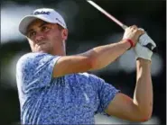  ?? DAVID DERMER — THE ASSOCIATED PRESS ?? Justin Thomas watches his tee shot on the 17th hole during the third round of the Bridgeston­e Invitation­al on Aug. 4 at Firestone Country Club.