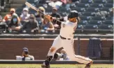  ?? Photos by Ezra Shaw / Getty Images ?? Shortstop Brandon Crawford wallops a threerun home run in the sixth inning at Oracle Park. The Giants are 42 in their past six games.