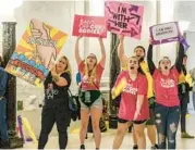  ?? CHRIS DORST/CHARLESTON GAZETTE-MAIL ?? Abortion-rights supporters protest Tuesday inside West Virginia’s Capitol.