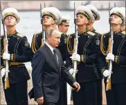  ?? MAXIM SHIPENKOV / AP ?? Russian President Vladimir Putin arrives to attend the military parade during the Navy Day celebratio­n in St. Petersburg, Russia, on Sunday.