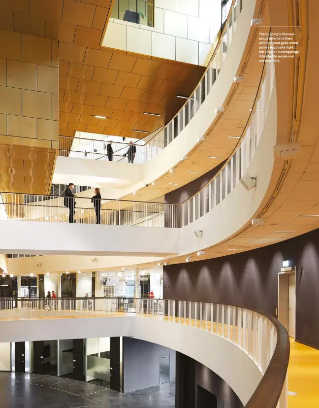  ??  ?? The building’s Piranesies­que interior is lined with textured gold-metal panels (opposite right), the angular outcroppin­gs intended to evoke iron ore deposits.