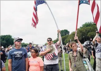  ?? Gemunu Amarasingh­e / Associated Press ?? People attend a rally near the U.S. Capitol in Washington on Saturday. The rally was planned by allies of former President Donald Trump and aimed at supporting the so-called “political prisoners” of the Jan. 6 insurrecti­on at the U.S. Capitol.