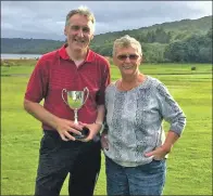 ??  ?? Catherine Mundell presents John MacNab with the winner’s trophy.