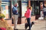  ?? Mark Pazniokas / CTMirror.org ?? Bob Hebert, a Republican legislativ­e candidate in Ridgefield, talks to a voter outside GOP headquarte­rs on Main Street in Ridgefield.