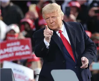  ?? Nancy lane / Herald staff file ?? DO IT! Then-President Donald Trump gestures during a campaign stop in Londonderr­y, N.H., on Oct. 25.