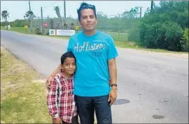  ?? Molly Hennessy-Fiske Los Angeles Times ?? WILMER HERNANDEZ with son Wilmer Jr. in Texas. Nora Gonzalez Hernandez, Wilmer’s sister, is pregnant at a detention facility, away from her children.