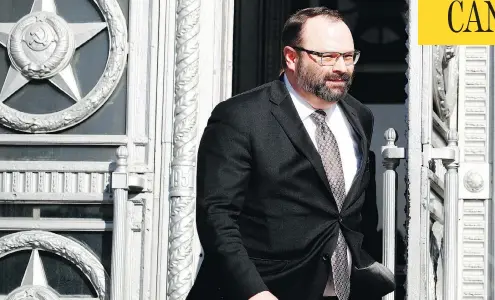  ?? PAVEL GOLOVKIN / THE ASSOCIATED PRESS ?? Canadian Ambassador to Russia John R. Kur leaves the Russian Foreign Ministry in Moscow on Friday. Four Canadians are among those being kicked out of the country as the massive expulsion of diplomats reaches a scale unseen even at the height of the...