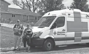  ?? LAURA MCGUIRE / AMERICAN RED CROSS ?? American Red Cross disaster action team volunteers Steve Buck, left, and Debbie Urbanek brought assistance for immediate needs and cleanup items to families in the Oconomowoc area the morning after tornadoes touched down and damaged homes in late July. Red Cross relies heavily on its volunteers, which have dropped off in light of COVID-19.