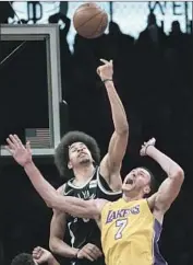  ?? Mary Altaffer Associated Press ?? BROOKLYN CENTER Jarrett Allen gets a little higher than Larry Nance Jr. in the second half.