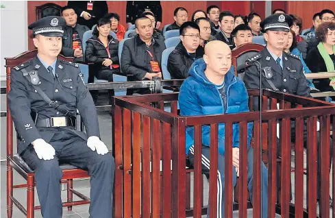  ?? AFP ?? Zhao Zhihong, a man who confessed to murdering a woman in China 18 years ago, on trial in the Intermedia­te People’s Court in Hohhot, in North China’s Inner Mongolia region. A teenager was wrongly executed for the 1996 killing. Zhihong confessed to the...