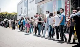  ?? MARIO TAMA/GETTY ?? Voters in Tijuana, Mexico, wait for more than an hour to participat­e in Sunday’s election.