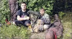  ?? Elise Amendola / Associated Press ?? Sam Suchmann, left, and Mattie Zufelt pose with ghoulish figures in 2016 at Sam’s house in Providence, R.I. “Sam & Mattie Make a Zombie Movie,” was released on Apple TV.