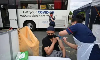  ??  ?? Covid-19 vaccinatio­n at a temporary centre at the Essa academy in Bolton, where ‘Indian variant’ case numbers have spiked. Photograph: Oli Scarff/AFP/Getty Images