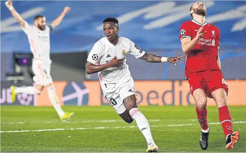  ?? AFP ?? Real Madrid’s Vinicius Junior, centre, celebrates after scoring against Liverpool during their Champions League quarter-final, first leg match.