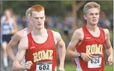  ?? Jeremy Stewart / Rome News-Tribune ?? Rome’s John Berry Bowling (left) and Sam Pierce lead the pace during boys’ varsity race of the 25th annual Ridge Ferry Invitation­al on Saturday. The pair would go on to finish in the top five of the the expansive field.