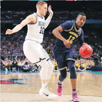  ?? TOM PENNINGTON/GETTY IMAGES ?? Muhammad-Ali Abdur-Rahkman of the Michigan Wolverines said “nobody expected us to be here” of the team’s appearance in the NCAA Tournament final against the Villanova Wildcats.