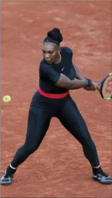  ?? THIBAULT CAMUS — THE ASSOCIATED PRESS ?? Serena Williams returns a shot against Ashleigh Barty during their second-round match in Paris on Thursday.