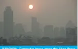  ?? ?? BANGKOK: Commuter boats cross the Chao Praya River amid high air pollution levels in Bangkok on February 15, 2024. — AFP